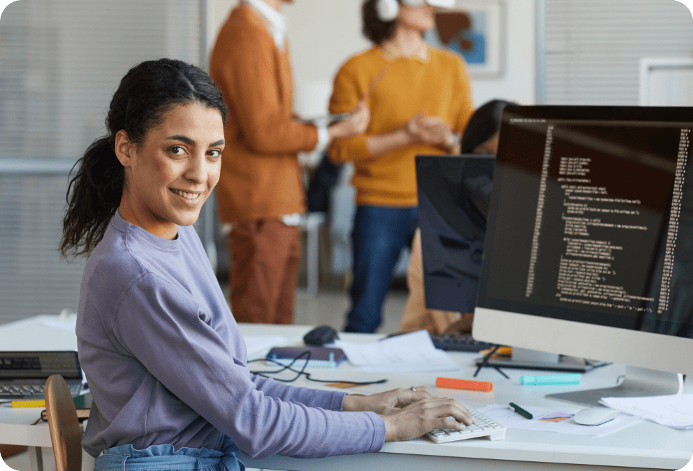 ethnic-young-woman-programming-software-in-office